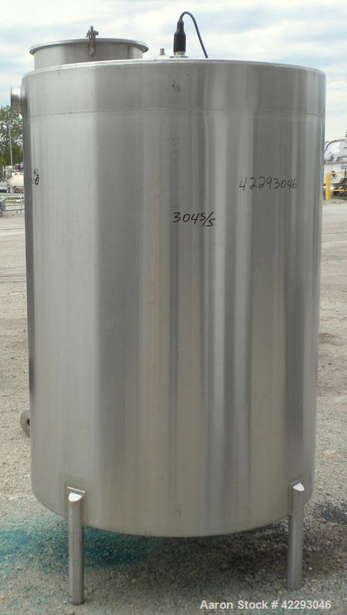 Used Hartel Tank, 500 Gallon, 304 Stainless Steel, Vertical. 48" Diameter x 66" straight side. Flat top and bottom. Openings: top 1-1/2" tri-clamp, 2" tri-clamp, (3) 3" tri-clamp, 16" manway with cov...