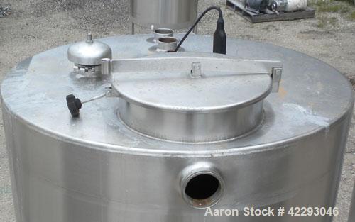 Used Hartel Tank, 500 Gallon, 304 Stainless Steel, Vertical. 48" Diameter x 66" straight side. Flat top and bottom. Openings: top 1-1/2" tri-clamp, 2" tri-clamp, (3) 3" tri-clamp, 16" manway with cov...