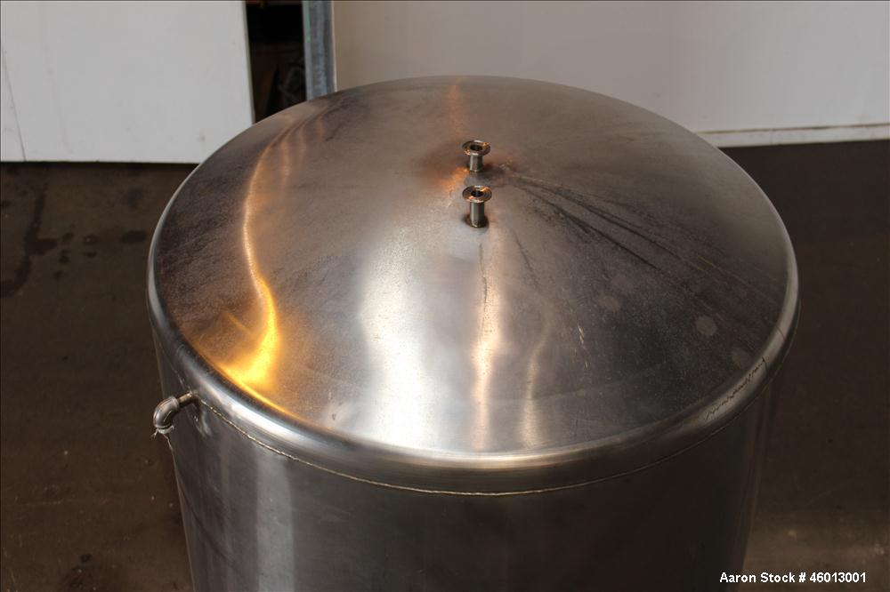 Used JV Northwest Inc. Tank, 600 Gallon, 304 Stainless steel, Vertical. Approximate 48" diameter x 72" straight side. Dished heads. Spray ball. Openings 22" X 16" man way with cover, top (2) 3/4" tri...