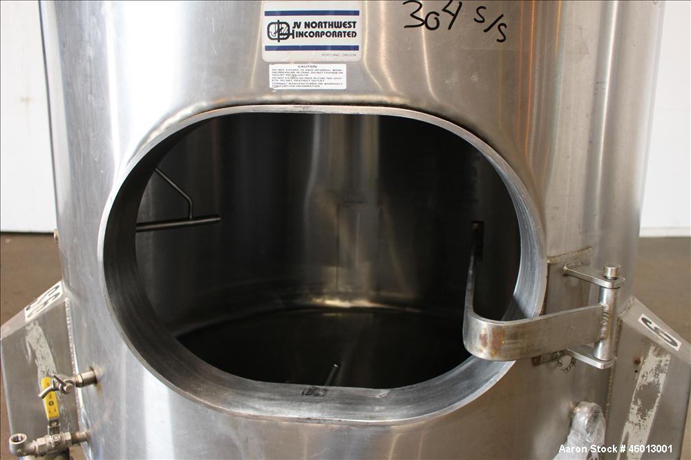 Used JV Northwest Inc. Tank, 600 Gallon, 304 Stainless steel, Vertical. Approximate 48" diameter x 72" straight side. Dished heads. Spray ball. Openings 22" X 16" man way with cover, top (2) 3/4" tri...