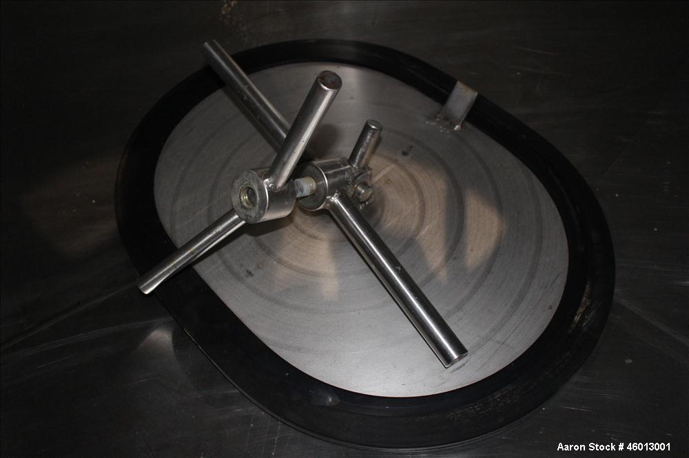 Used JV Northwest Inc. Tank, 600 Gallon, 304 Stainless steel, Vertical. Approximate 48" diameter x 72" straight side. Dished heads. Spray ball. Openings 22" X 16" man way with cover, top (2) 3/4" tri...