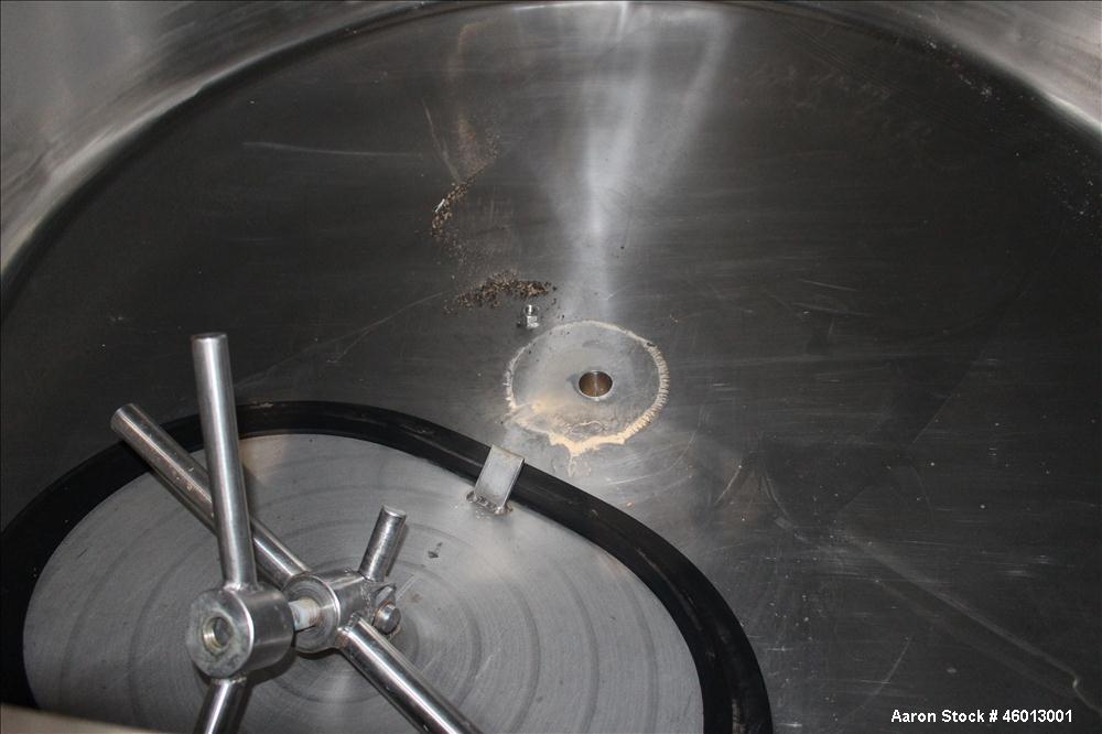 Used JV Northwest Inc. Tank, 600 Gallon, 304 Stainless steel, Vertical. Approximate 48" diameter x 72" straight side. Dished heads. Spray ball. Openings 22" X 16" man way with cover, top (2) 3/4" tri...