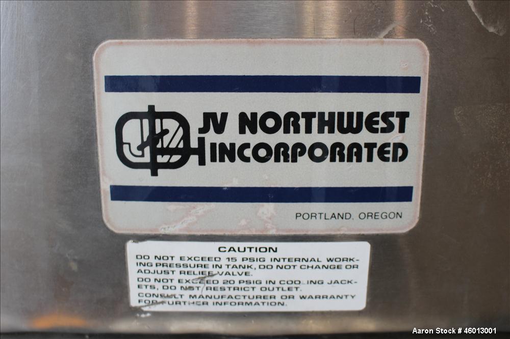 Used JV Northwest Inc. Tank, 600 Gallon, 304 Stainless steel, Vertical. Approximate 48" diameter x 72" straight side. Dished heads. Spray ball. Openings 22" X 16" man way with cover, top (2) 3/4" tri...