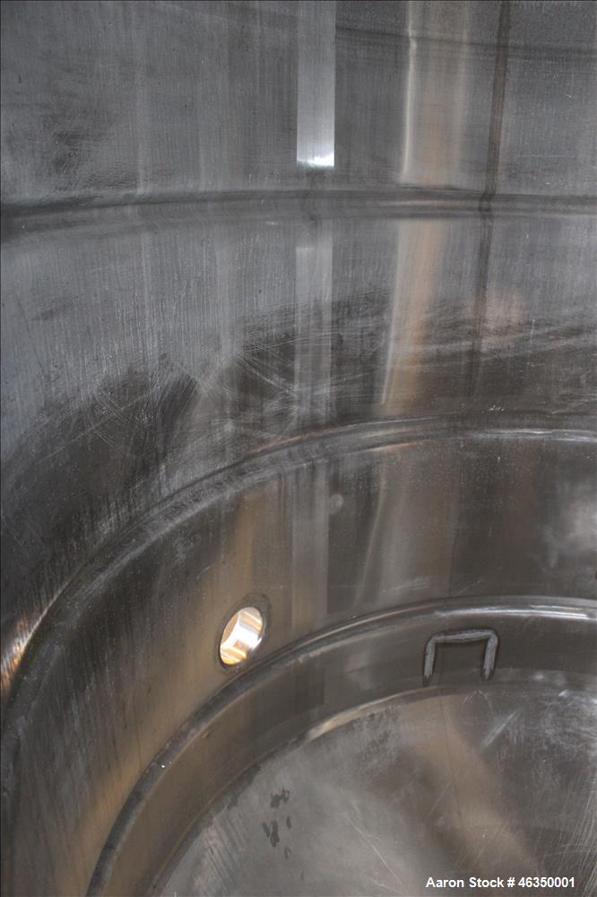 Used Mojonnier Brothers Tank, Size 443, Approximately 700 Gallons, 304 Stainless Steel, Vertical. Approximately 54" diameter x 61" straight side. Dish top, partially jacketed 42" cone bottom, no rati...