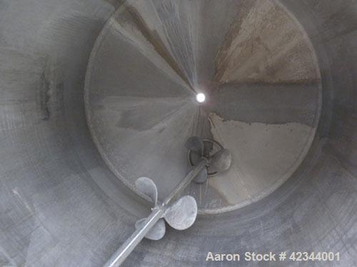Used Tank, 750 Gallon, 304 Stainless Steel, Vertical. 56" Diameter x 70" straight side, dished 316 stainless steel top, coned bottom. Off center top entering Lightnin agitator, model N33G-150, 1-1/2"...