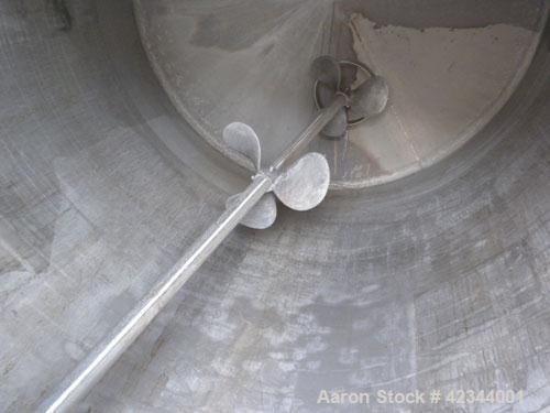 Used Tank, 750 Gallon, 304 Stainless Steel, Vertical. 56" Diameter x 70" straight side, dished 316 stainless steel top, coned bottom. Off center top entering Lightnin agitator, model N33G-150, 1-1/2"...