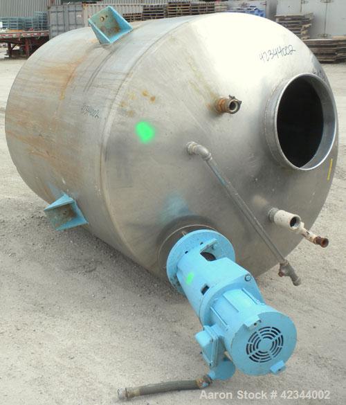 Used Tank, 750 Gallon, 304 Stainless Steel, Vertical. 56" Diameter x 70" straight side, dished 316 stainless steel top, coned bottom. Off center top entering Lightnin agitator, model N33G-150, 1-1/2"...