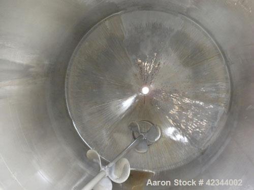 Used Tank, 750 Gallon, 304 Stainless Steel, Vertical. 56" Diameter x 70" straight side, dished 316 stainless steel top, coned bottom. Off center top entering Lightnin agitator, model N33G-150, 1-1/2"...