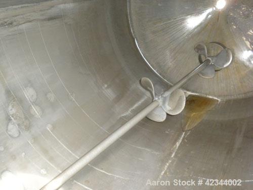 Used Tank, 750 Gallon, 304 Stainless Steel, Vertical. 56" Diameter x 70" straight side, dished 316 stainless steel top, coned bottom. Off center top entering Lightnin agitator, model N33G-150, 1-1/2"...