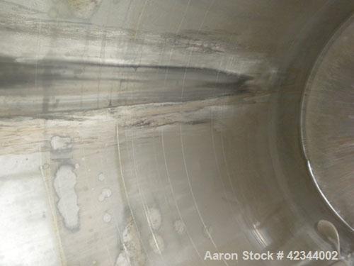 Used Tank, 750 Gallon, 304 Stainless Steel, Vertical. 56" Diameter x 70" straight side, dished 316 stainless steel top, coned bottom. Off center top entering Lightnin agitator, model N33G-150, 1-1/2"...