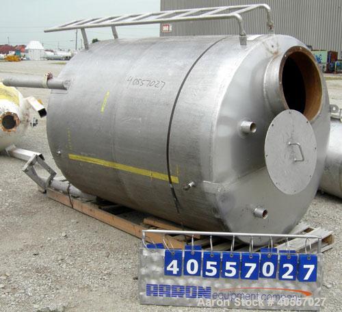 Used Tank, 900 Gallon, 304 Stainless Steel, Vertical. Approximately 60" diameter x 72" straight side. Coned top and bottom. Openings: top (2) 2 1/4" threaded, 18" manway with cover, side mounted ladd...
