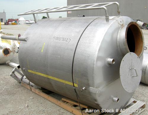 Used Tank, 900 Gallon, 304 Stainless Steel, Vertical. Approximately 60" diameter x 72" straight side. Coned top and bottom. Openings: top (2) 2 1/4" threaded, 18" manway with cover, side mounted ladd...