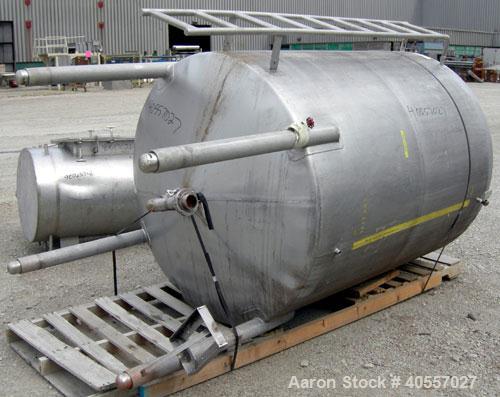 Used Tank, 900 Gallon, 304 Stainless Steel, Vertical. Approximately 60" diameter x 72" straight side. Coned top and bottom. Openings: top (2) 2 1/4" threaded, 18" manway with cover, side mounted ladd...