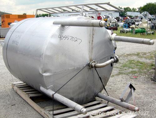 Used Tank, 900 Gallon, 304 Stainless Steel, Vertical. Approximately 60" diameter x 72" straight side. Coned top and bottom. Openings: top (2) 2 1/4" threaded, 18" manway with cover, side mounted ladd...