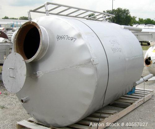 Used Tank, 900 Gallon, 304 Stainless Steel, Vertical. Approximately 60" diameter x 72" straight side. Coned top and bottom. Openings: top (2) 2 1/4" threaded, 18" manway with cover, side mounted ladd...
