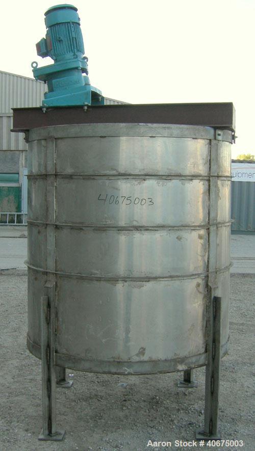 Used Tank, 700 gallon, 304 stainless steel, vertical. 58" diameter x 60" straight side. Open top, no cover, coned bottom. Off center bolt on carbon steel agitator bridge with a Chemineer agitator, mo...