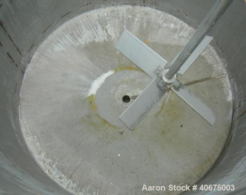 Used Tank, 700 gallon, 304 stainless steel, vertical. 58" diameter x 60" straight side. Open top, no cover, coned bottom. Off center bolt on carbon steel agitator bridge with a Chemineer agitator, mo...