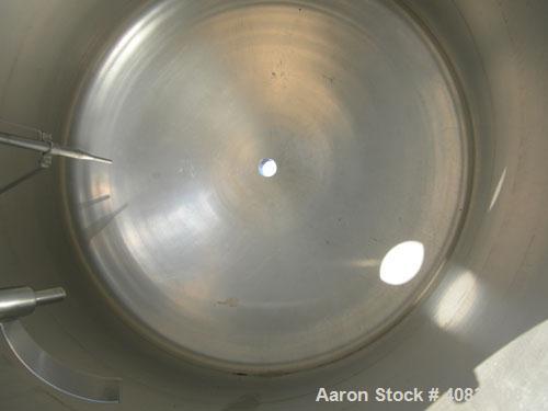 Used Tank, 950 Gallon, 316 Stainless Steel, Vertical. 64" Diameter x 64" straight side, dished top and bottom. (2) Finger up baffle. Openings top 18" manway with cover, (2) 4", 8", (2) 2-1/2", 4-1/2"...