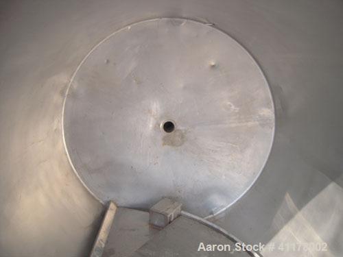 Used Tank, 600 Gallon, 304 Stainless Steel, Vertical. 54" diameter x 60" straight side. Open top with 1 piece hinged cover, slight dish bottom. 3-1/2" NPT center bottom outlet. Mounted on 5 stainless...