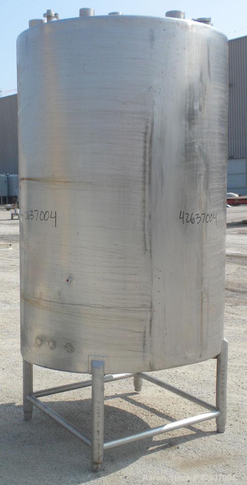 Used Tank, 825 Gallon, 304 Stainless Steel, Vertical. Approximately 55-1/2" diameter x 80" straight side, flat top, sloped bottom. Openings top 1-1/2" tri-clamp, (2) 3" tri-clamp, (2) 3", (2) 4-1/2",...