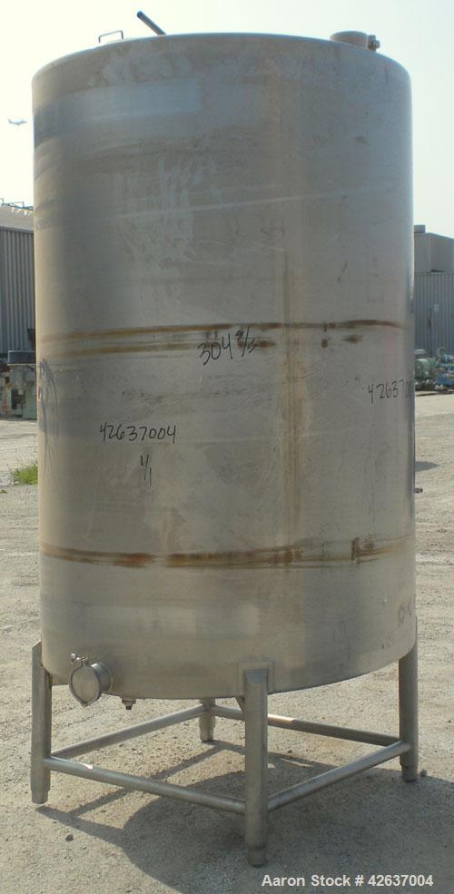 Used Tank, 825 Gallon, 304 Stainless Steel, Vertical. Approximately 55-1/2" diameter x 80" straight side, flat top, sloped bottom. Openings top 1-1/2" tri-clamp, (2) 3" tri-clamp, (2) 3", (2) 4-1/2",...