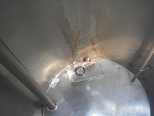 Used Tank, 825 Gallon, 304 Stainless Steel, Vertical. Approximately 55-1/2" diameter x 80" straight side, flat top, sloped bottom. Openings top 1-1/2" tri-clamp, (2) 3" tri-clamp, (2) 3", (2) 4-1/2",...