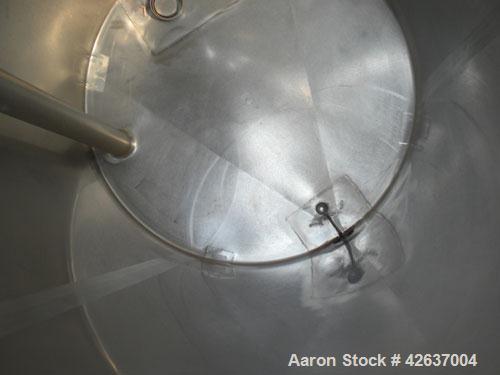 Used Tank, 825 Gallon, 304 Stainless Steel, Vertical. Approximately 55-1/2" diameter x 80" straight side, flat top, sloped bottom. Openings top 1-1/2" tri-clamp, (2) 3" tri-clamp, (2) 3", (2) 4-1/2",...