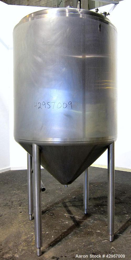 Used Tank, 500 Gallon, 316 Stainless Steel, Vertical. Dish top, insulated coned bottom. (2) Spray balls. Openings top 18" man way with cover, (3) 3" tri-clamp, (2) 2-1/2” tri-clamp, side 2” tri-clamp...