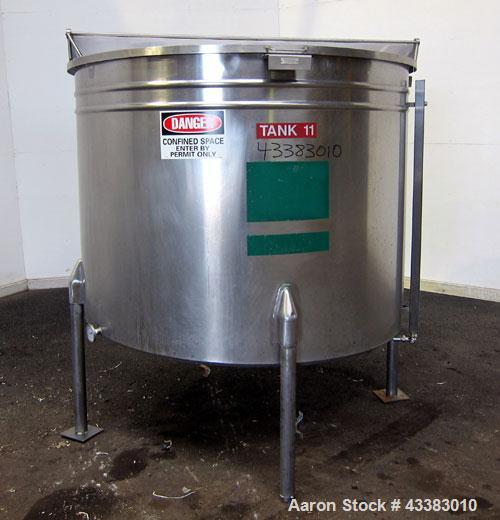Used Tank, 580 Gallon, 304 Stainless Steel, Vertical. Approximate 62” diameter x 45” straight side, flat top with a bolt on cover with a 1/3 hinged opening, sloped bottom. Side bottom entering agitat...