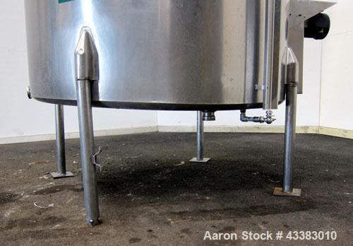 Used Tank, 580 Gallon, 304 Stainless Steel, Vertical. Approximate 62” diameter x 45” straight side, flat top with a bolt on cover with a 1/3 hinged opening, sloped bottom. Side bottom entering agitat...
