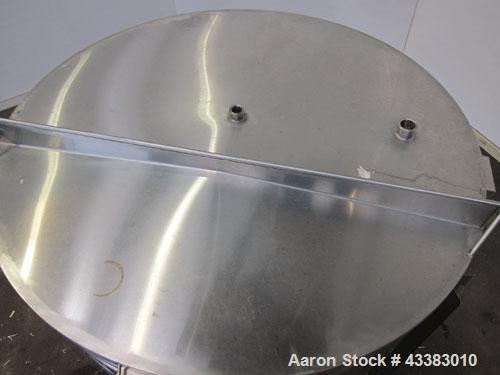 Used Tank, 580 Gallon, 304 Stainless Steel, Vertical. Approximate 62” diameter x 45” straight side, flat top with a bolt on cover with a 1/3 hinged opening, sloped bottom. Side bottom entering agitat...