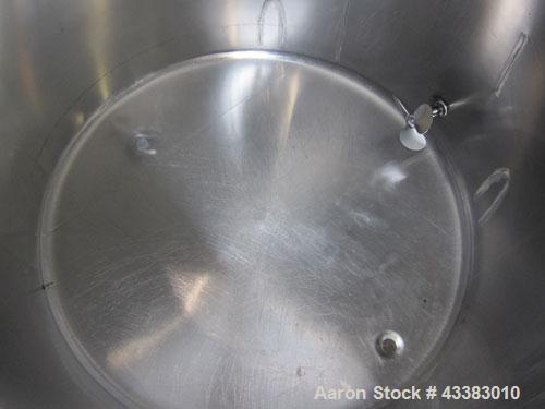 Used Tank, 580 Gallon, 304 Stainless Steel, Vertical. Approximate 62” diameter x 45” straight side, flat top with a bolt on cover with a 1/3 hinged opening, sloped bottom. Side bottom entering agitat...