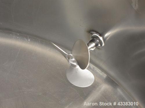 Used Tank, 580 Gallon, 304 Stainless Steel, Vertical. Approximate 62” diameter x 45” straight side, flat top with a bolt on cover with a 1/3 hinged opening, sloped bottom. Side bottom entering agitat...