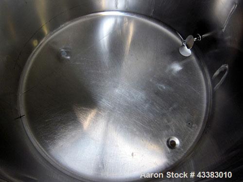 Used Tank, 580 Gallon, 304 Stainless Steel, Vertical. Approximate 62” diameter x 45” straight side, flat top with a bolt on cover with a 1/3 hinged opening, sloped bottom. Side bottom entering agitat...