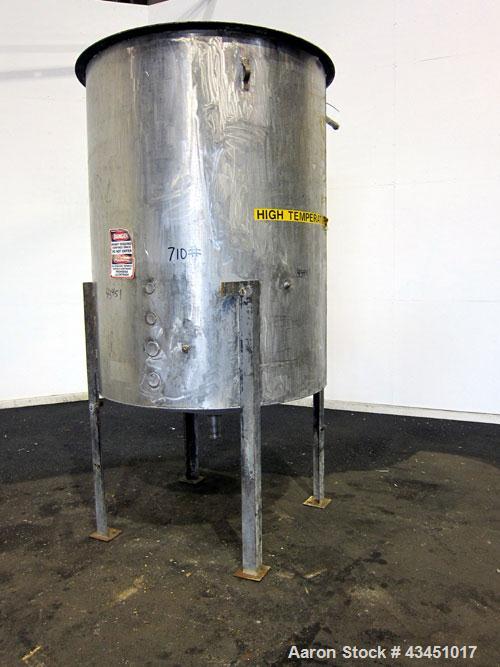 Used Tank, 750 Gallon, 304 Stainless Steel, Vertical. Approximate 55" diameter x 72" straight side. Open top, no cover, coned bottom. 2-1/2" Center bottom outlet. Mounted on 4 carbon steel legs, appr...