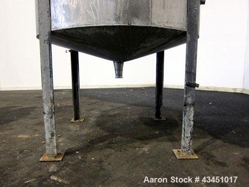Used Tank, 750 Gallon, 304 Stainless Steel, Vertical. Approximate 55" diameter x 72" straight side. Open top, no cover, coned bottom. 2-1/2" Center bottom outlet. Mounted on 4 carbon steel legs, appr...