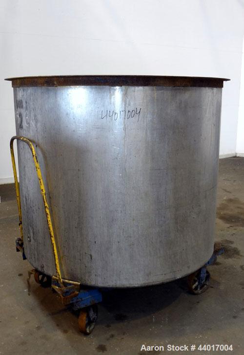 Used Tank, 520 Gallons, 304 Stainless Steel, Vertical. Approximate 56-1/2" diameter x 48" straight side, open top, no cover, flat bottom. 1-1/2" Center bottom outlet. Mounted on a carbon steel frame ...