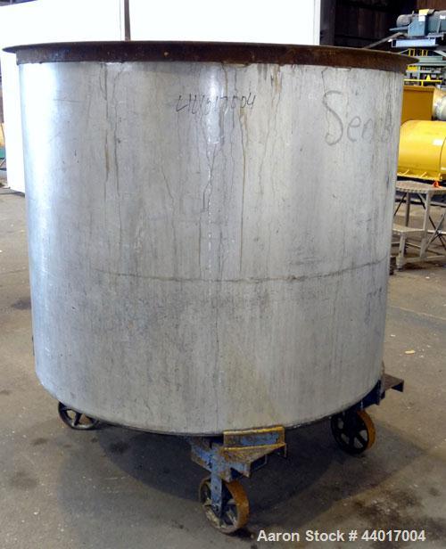 Used Tank, 520 Gallons, 304 Stainless Steel, Vertical. Approximate 56-1/2" diameter x 48" straight side, open top, no cover, flat bottom. 1-1/2" Center bottom outlet. Mounted on a carbon steel frame ...