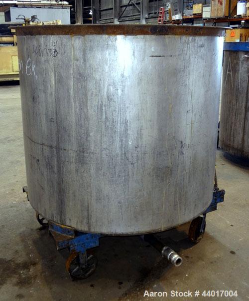 Used Tank, 520 Gallons, 304 Stainless Steel, Vertical. Approximate 56-1/2" diameter x 48" straight side, open top, no cover, flat bottom. 1-1/2" Center bottom outlet. Mounted on a carbon steel frame ...