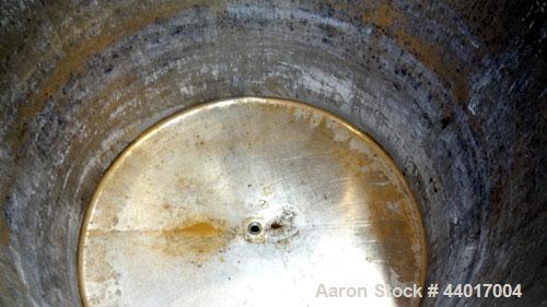 Used Tank, 520 Gallons, 304 Stainless Steel, Vertical. Approximate 56-1/2" diameter x 48" straight side, open top, no cover, flat bottom. 1-1/2" Center bottom outlet. Mounted on a carbon steel frame ...