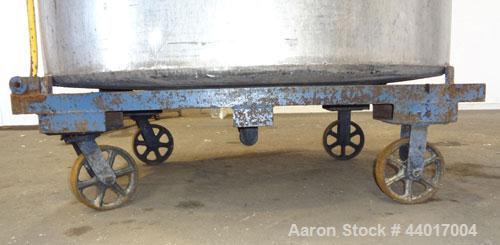 Used Tank, 520 Gallons, 304 Stainless Steel, Vertical. Approximate 56-1/2" diameter x 48" straight side, open top, no cover, flat bottom. 1-1/2" Center bottom outlet. Mounted on a carbon steel frame ...