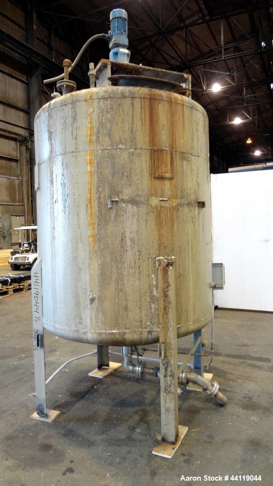 Used Tank, 750 Gallon, 316 Stainless Steel, Vertical. Approximate 60" diameter x 63" straight side, dished top and bottom. Top entering Chemineer agitator, serial# 550948-1. Approximate 1-1/2" diamet...