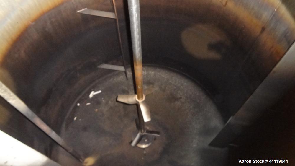 Used Tank, 750 Gallon, 316 Stainless Steel, Vertical. Approximate 60" diameter x 63" straight side, dished top and bottom. Top entering Chemineer agitator, serial# 550948-1. Approximate 1-1/2" diamet...