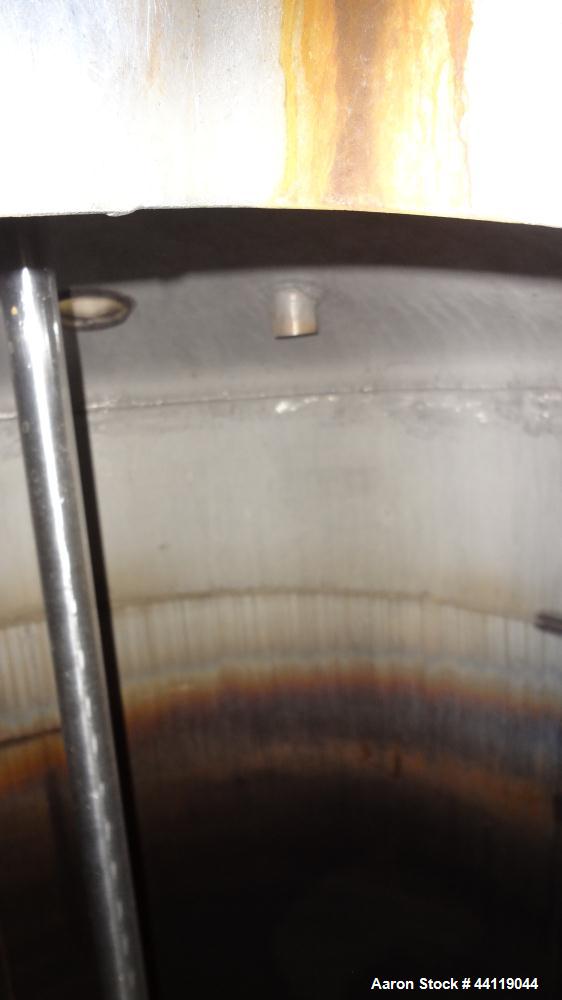Used Tank, 750 Gallon, 316 Stainless Steel, Vertical. Approximate 60" diameter x 63" straight side, dished top and bottom. Top entering Chemineer agitator, serial# 550948-1. Approximate 1-1/2" diamet...