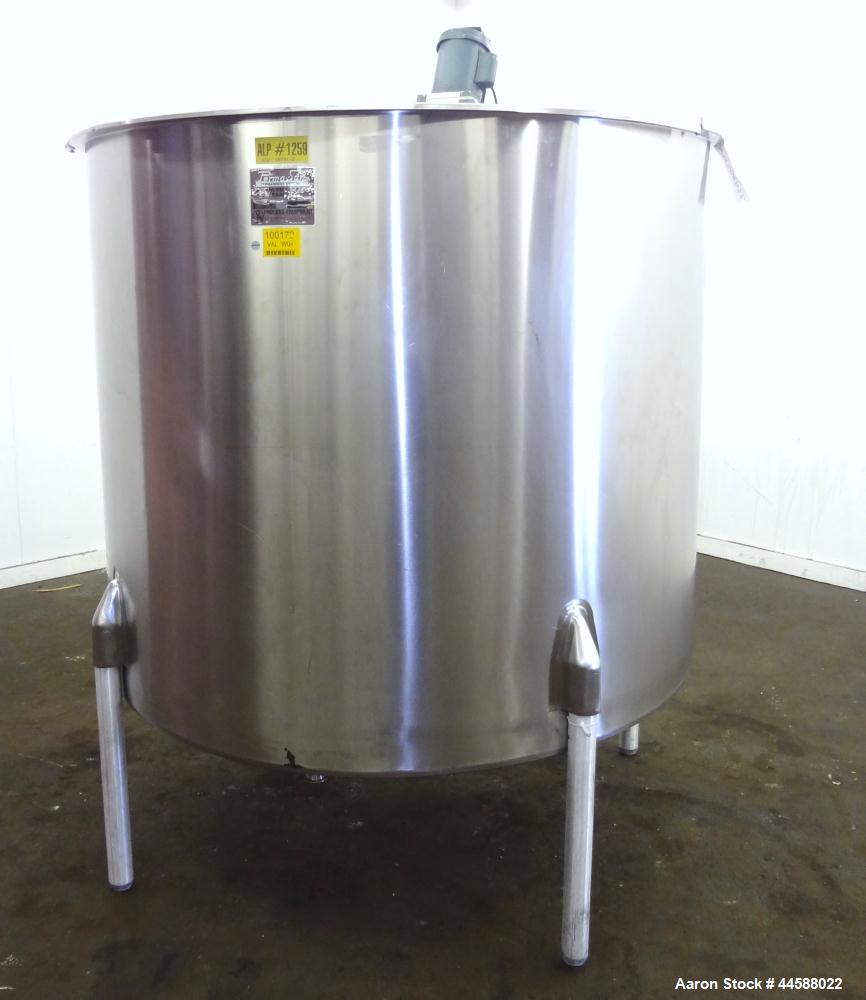 Used Perma-San Tank, 650 Gallons, Model OVS, 316 Stainless Steel, Vertical. Approximately 62" diameter x 51" straight side, open top with (2) 1/3 covers, sloped bottom. Lightnin clamp-on agitator, mo...