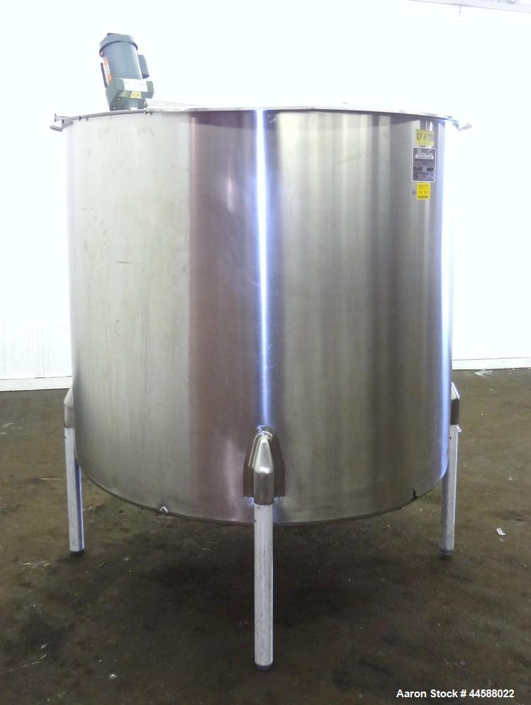 Used Perma-San Tank, 650 Gallons, Model OVS, 316 Stainless Steel, Vertical. Approximately 62" diameter x 51" straight side, open top with (2) 1/3 covers, sloped bottom. Lightnin clamp-on agitator, mo...