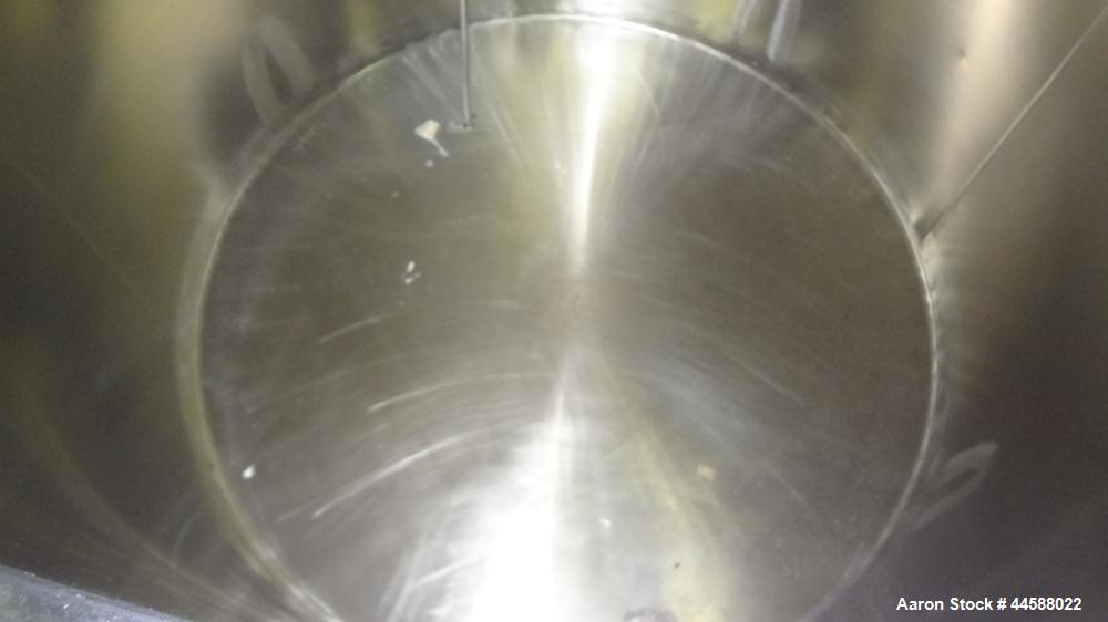 Used Perma-San Tank, 650 Gallons, Model OVS, 316 Stainless Steel, Vertical. Approximately 62" diameter x 51" straight side, open top with (2) 1/3 covers, sloped bottom. Lightnin clamp-on agitator, mo...