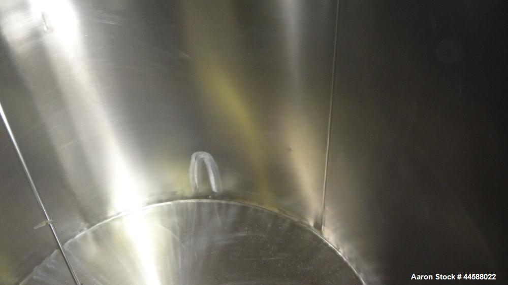 Used Perma-San Tank, 650 Gallons, Model OVS, 316 Stainless Steel, Vertical. Approximately 62" diameter x 51" straight side, open top with (2) 1/3 covers, sloped bottom. Lightnin clamp-on agitator, mo...