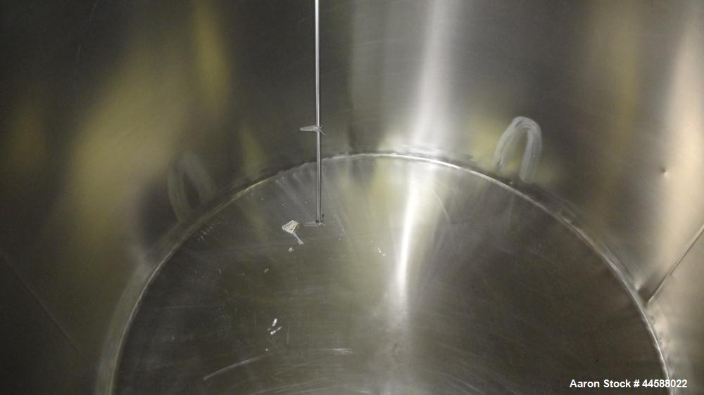 Used Perma-San Tank, 650 Gallons, Model OVS, 316 Stainless Steel, Vertical. Approximately 62" diameter x 51" straight side, open top with (2) 1/3 covers, sloped bottom. Lightnin clamp-on agitator, mo...