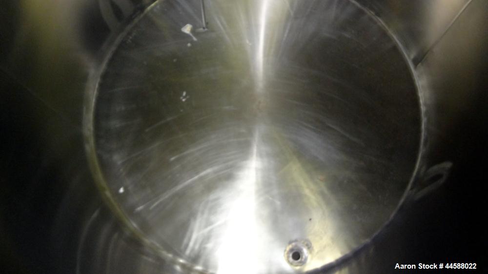 Used Perma-San Tank, 650 Gallons, Model OVS, 316 Stainless Steel, Vertical. Approximately 62" diameter x 51" straight side, open top with (2) 1/3 covers, sloped bottom. Lightnin clamp-on agitator, mo...